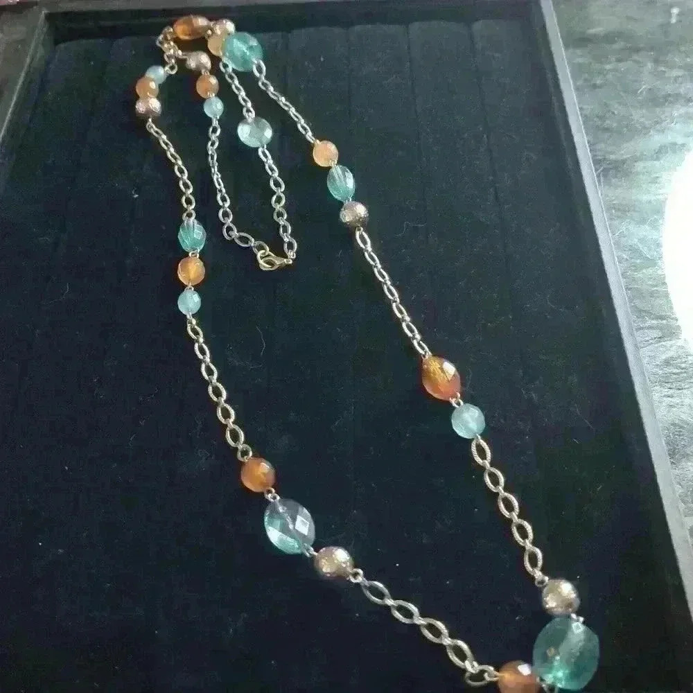 Plunder long sliver tone beaded necklace